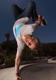 Tony Hawk performing an impressive skateboard trick upside down in a skate park, showcasing his incredible skills and style.