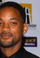 Will Smith smiling at an event, showcasing his signature style and charm as an actor, rapper, and film producer.