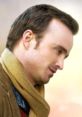 Profile view of a man with a scarf, embodying a relaxed and thoughtful vibe, evocative of themes in "ADAM.
