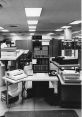 Historic IBM 7094 computer setup featuring data processors and peripherals in a vintage computing environment.