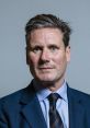 Keir Starmer, leader of the Labour Party, poses in formal attire, emphasizing his political image and leadership qualities.