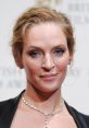 Uma Thurman showcases elegance at the British Film Awards, stunning with a diamond necklace and glamorous makeup.