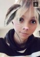 Young person with digital bunny ears and whiskers filter, showcasing playful creativity and digital expression.