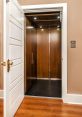 Modern home elevator with polished wooden interior, open door, and soft lighting for easy access between floors.