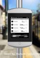 Smart bus shelter display showing real-time bus arrivals and times for various routes in an urban setting.