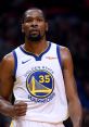 Kevin Durant celebrates a play during a Golden State Warriors game, showcasing his competitive spirit and skill on the court.