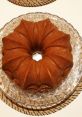 Delicious Domca Babovka on a decorative dish, showcasing its unique bundt shape and golden-brown color. Perfect dessert idea.