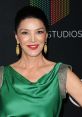 Shohreh Aghdashloo showcases elegance in a green gown at a red carpet event, spotlighting her stunning style and charisma.