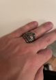 AJ Ring featuring intricate lion design worn on a hand, showcasing unique craftsmanship and bold jewelry style.