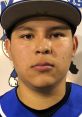 Portrait of Johnny Gomez, a young athlete in a baseball uniform, showcasing determination and focus on the field.