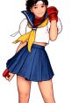Sakura Kasugano in a dynamic pose, wearing a sporty outfit, showcasing her signature style from the fighting game series.