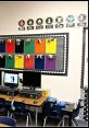 Colorful classroom bulletin board with educational displays and computer stations in Ack's Classroom.