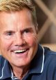 Dieter Bohlen smiling brightly, showcasing his cheerful demeanor during a captivating moment.