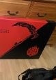 Red and black box featuring a scythe design, labeled as "Replica," showcasing Package Number 2 collectibles.