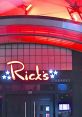Rick's Cabaret entrance with vibrant red lighting, showcasing the iconic sign and welcoming atmosphere for visitors.