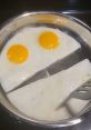 Fried eggs in a pan arranged to resemble a smiling face, showcasing a fun breakfast idea for Small Town Sally.