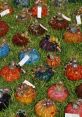 Colorful glass pumpkins in various shapes and tones displayed on grass, perfect for autumn decor and seasonal celebrations.