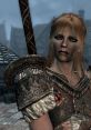 Sultry woman from Skyrim, wearing rugged armor with a fierce expression, set against a mystical Nordic backdrop.