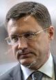 Serious portrait of Alexander Nowak with glasses, showcasing a thoughtful expression in a professional setting.