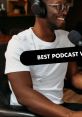 Man with glasses smiling while recording a podcast, showcasing engaging content and vibrant atmosphere. Best podcast vibes!