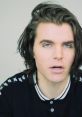 Onision (Gregory James Daniel) appearing enraged with raised voice, expressing intense emotion in a candid moment.