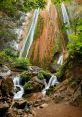 Majestic waterfalls cascade down rocky cliffs, surrounded by lush greenery, capturing the serene beauty of Luimikion's nature.