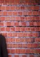 Dimitri V1 stands against a textured brick wall, showcasing a blend of urban style and modern aesthetics.