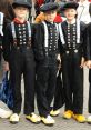 Holland Boys in traditional attire, featuring black outfits with buttons and wooden shoes, showcasing Dutch culture.