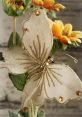 Elegant gold butterfly ornament among vibrant yellow flowers, perfect for juty decoration and floral arrangements.