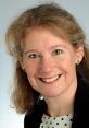 Professional headshot of Alison Langley, showcasing her friendly smile and engaging personality against a neutral background.