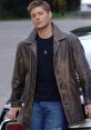 Character in a leather jacket and jeans, exuding confidence and charm, perfect for L&C'om's stylish vibe.