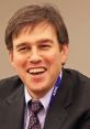 et Stephens smiling at an AIPAC event, showcasing his engaging presence in discussions on political issues.