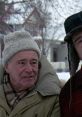 Grumpy old men enjoy a winter day, showcasing their iconic friendship and humorous banter against a snowy backdrop.
