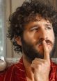 DaveFX with a thoughtful expression, wearing a red striped shirt, surrounded by a serene indoor setting.