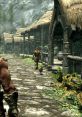 Scenic view of a peaceful village in Elder Scrolls, featuring characters strolling and a chicken wandering along cobblestones.