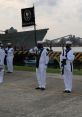 Naval ceremony at Marina in Mexico, showcasing sailors in uniform with a flag, emphasizing maritime tradition and honor.