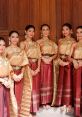 Traditional Thai dancers in elegant gold and burgundy attire showcase the beauty of Premwadee culture and heritage.