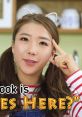 Excited Jenny shows playful creativity with cat ears, inviting viewers to enjoy a fun cooking adventure in an engaging style.