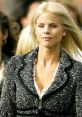 Elin (Swedish) showcases elegant fashion with a stylish black and white jacket, exuding confidence and grace.