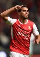 Ricardo celebrates a goal wearing the SC Braga home jersey during a thrilling match, showcasing his soccer skills.