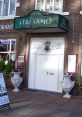 Italian restaurant entrance featuring a classic design and welcoming signage, perfect for enjoying authentic cuisine.